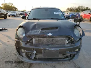2013 MINI Coupe S z VIN WMWSX3C57DT408719, wystawiony jako Copart lot #75440574 z przebiegiem Nie podano mil oraz Szkody całkowita. Historia ofert i sprzedaży dostępna na DreamBid. Obrazek 5.