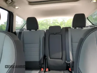 2016 Ford Escape SE z VIN 1FMCU9G97GUB45352, wystawiony jako Copart lot #60001055 z przebiegiem 93 685 mil mil oraz Szkoda całkowita • Salvage title. Historia ofert i sprzedaży dostępna na DreamBid. Obrazek 10.