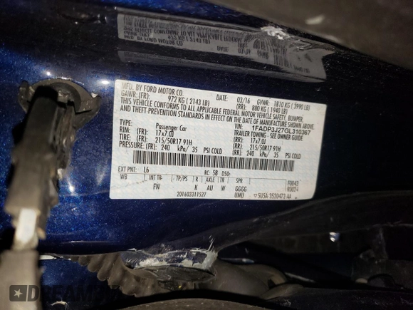 2016 Ford Focus Titanium z VIN 1FADP3J27GL310367, wystawiony jako Copart lot #55048005 z przebiegiem 86 676 mil mil oraz Szkoda całkowita • Salvage title. Historia ofert i sprzedaży dostępna na DreamBid. Obrazek 13.