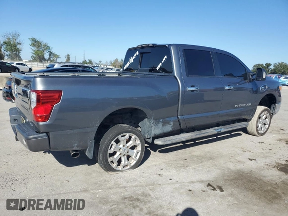 2016 Nissan Titan XD PRO-4X with VIN 1N6BA1F47GN510491, listed as a Copart auction lot 77826454 with 102,285 mi miles and Clean Title. Bid and sale history available at carsss.com. Image 3.