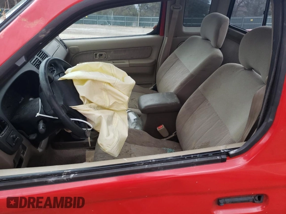 1999 Nissan Frontier XE with VIN 1N6ED26Y4XC313142, listed as a Copart auction lot 85777354 with 122,822 mi miles and Salvage title. Bid and sale history available at DreamBid. Image 7.
