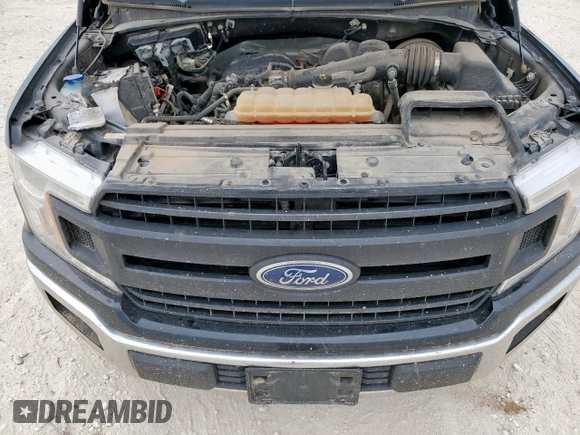 2018 Ford F-150 XL with VIN 1FTMF1CB9JKC79358, listed as a Copart auction lot 57774995 with 112,543 mi miles and Salvage title. Bid and sale history available at DreamBid. Image 11.