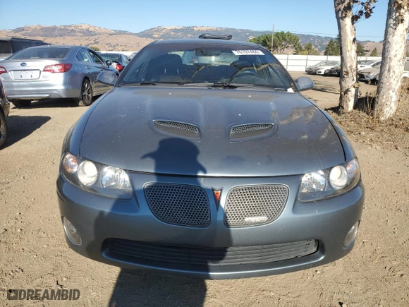 2005 Pontiac GTO with VIN 6G2VX12U45L462386, listed as a Copart auction lot 76197484 with 142,775 mi miles and Salvage Title. Bid and sale history available at carsss.com. Image 5.