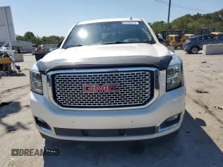 2015 GMC Yukon Denali with VIN 1GKS2CKJ3FR663324, listed as a Copart auction lot 70306614 with 154,234 mi miles and Salvage Title. Bid and sale history available at carsss.com. Image 5.