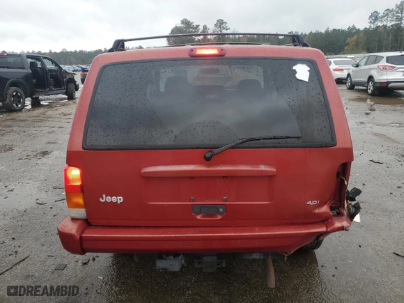 1999 Jeep Cherokee Sport with VIN 1J4FT68S1XL601799, listed as a Copart auction lot 83881844 with 203,572 mi miles and Salvage Title. Bid and sale history available at carsss.com. Image 6.