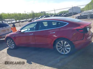2018 Tesla Model 3 Long Range Battery z VIN 5YJ3E1EA3JF047287, wystawiony jako IAAI lot #42099771 z przebiegiem 120 470 mil mil oraz . Historia ofert i sprzedaży dostępna na DreamBid. Obrazek 13.