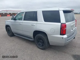 2015 Chevrolet Tahoe Commercial with VIN 1GNSK2ECXFR681555, listed as a IAAI auction lot 41975359 with 126,785 mi miles. Bid and sale history available at carsss.com. Image 3.