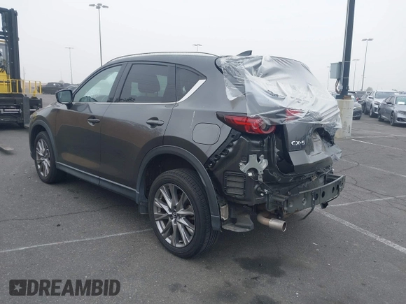 2021 Mazda CX-5 Grand Touring with VIN JM3KFADM2M1340669, listed as a IAAI auction lot 41916687 with 83,872 mi miles. Bid and sale history available at carsss.com. Image 3.
