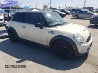 2009 MINI Hardtop S with VIN WMWMF73569TW80561, listed as a Copart auction lot 52615805 with 109,968 mi miles and Salvage title. Bid and sale history available at DreamBid. Image 4.