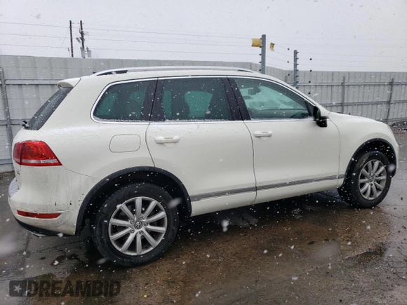 2011 Volkswagen Touareg Sport with VIN WVGFF9BP8BD002982, listed as a Copart auction lot 53958555 with 156,742 mi miles and Salvage Title. Bid and sale history available at DreamBid. Image 3.