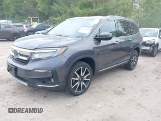 2020 Honda Pilot Elite with VIN 5FNYF6H00LB027472, listed as a IAAI auction lot 42253478 with 69,988 mi miles and . Bid and sale history available at DreamBid. Image 2.