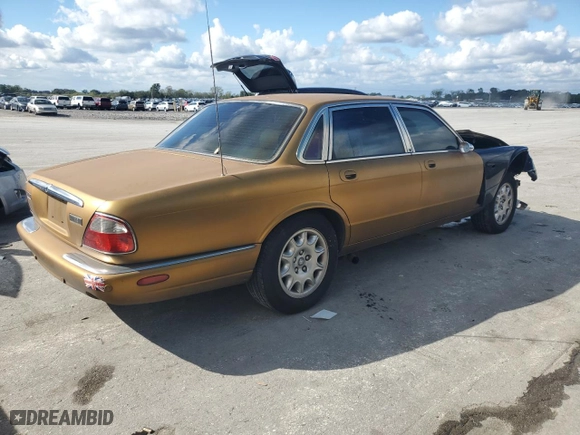 2001 Jaguar XJ with VIN SAJDA14C81LF27992, listed as a Copart auction lot 73808614 with 71,749 mi miles and Salvage Title. Bid and sale history available at carsss.com. Image 3.
