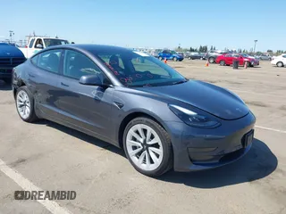2022 Tesla Model 3 with VIN 5YJ3E1EA6NF144098, listed as a IAAI auction lot 41965360 with 75,597 mi miles. Bid and sale history available at carsss.com. Image 1.