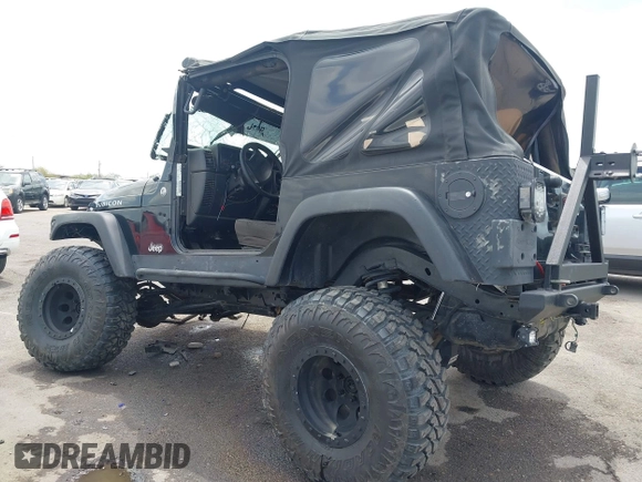 2004 Jeep Wrangler Rubicon z VIN 1J4FA69S84P727716, wystawiony jako IAAI lot #42162129 z przebiegiem 90 844 mil mil oraz . Historia ofert i sprzedaży dostępna na DreamBid. Obrazek 3.