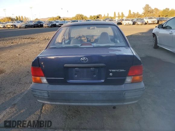 1996 Toyota Tercel DX z VIN JT2AC52L5T0190097, wystawiony jako Copart lot #76574844 z przebiegiem 175 256 mil mil oraz Tytuł czysty. Historia ofert i sprzedaży dostępna na DreamBid. Obrazek 6.