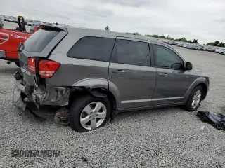 2013 Dodge Journey American Value with VIN 3C4PDCAB7DT500878, listed as a Copart auction lot 58397655 with 183,755 mi miles and Salvage title. Bid and sale history available at DreamBid. Image 3.