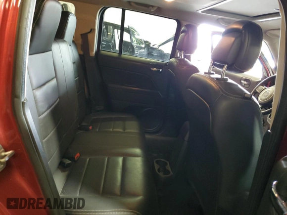 2016 Jeep Patriot High Altitude with VIN 1C4NJRFBXGD597578, listed as a Copart auction lot 58857115 with 128,911 mi miles and Salvage title. Bid and sale history available at DreamBid. Image 11.