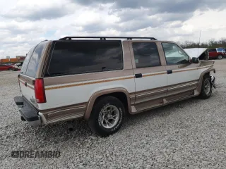 1999 Chevrolet Suburban with VIN 3GNEC16R9XG143471, listed as a Copart auction lot 53856565 with 208,621 mi miles and Salvage title. Bid and sale history available at DreamBid. Image 3.