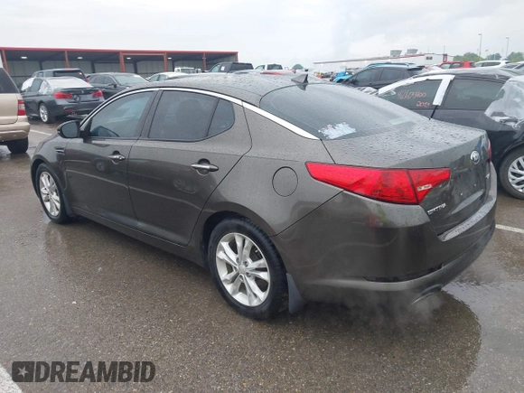2013 Kia Optima EX z VIN 5XXGN4A79DG181719, wystawiony jako IAAI lot #42372478 z przebiegiem 166 410 mil mil oraz . Historia ofert i sprzedaży dostępna na DreamBid. Obrazek 14.