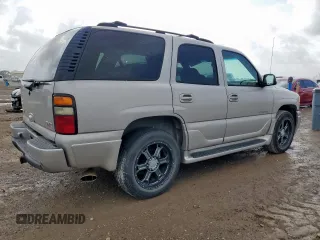 2004 GMC Yukon Denali z VIN 1GKEK63U84J298285, wystawiony jako Copart lot #59865815 z przebiegiem 168 414 mil mil oraz Czysty tytuł • Clean title. Historia ofert i sprzedaży dostępna na DreamBid. Obrazek 3.