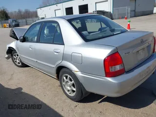 2000 Mazda Protege DX with VIN JM1BJ2227Y0240819, listed as a IAAI auction lot 41810228 with 68,650 mi miles and . Bid and sale history available at DreamBid. Image 3.