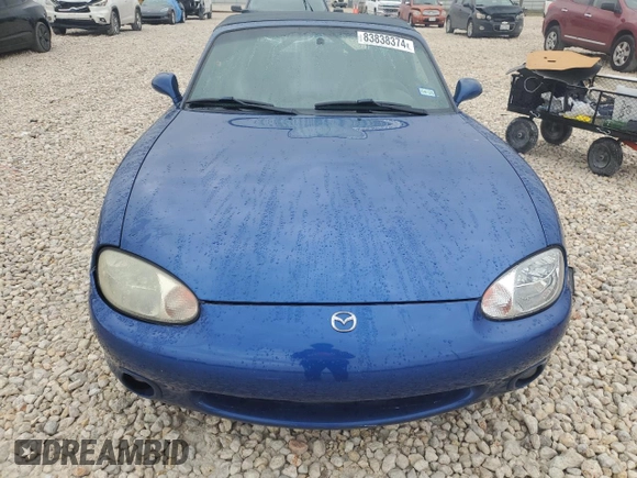 1999 Mazda MX-5 Miata with VIN JM1NB3532X0134801, listed as a Copart auction lot 83838374 with 97,015 mi miles and Salvage title. Bid and sale history available at DreamBid. Image 5.