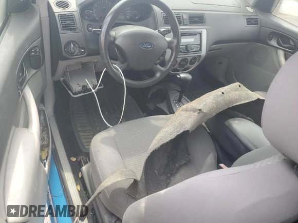 2007 Ford Focus S z VIN 1FAFP31N77W138844, wystawiony jako Copart lot #60702195 z przebiegiem Nie podano mil oraz Czysty tytuł • Clean title. Historia ofert i sprzedaży dostępna na DreamBid. Obrazek 8.