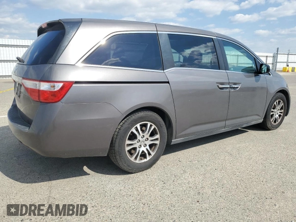 2011 Honda Odyssey EX-L with VIN 5FNRL5H61BB056652, listed as a Copart auction lot 54774015 with 233,125 mi miles and Salvage Title. Bid and sale history available at DreamBid. Image 3.