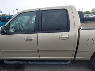 2001 Ford F-150 SuperCrew XLT with VIN 1FTRW07W61KE35305, listed as a IAAI auction lot 41912087 with 221,826 mi miles. Bid and sale history available at carsss.com. Image 14.