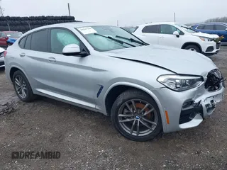 2020 BMW X4 xDrive30i z VIN 5UX2V1C07L9B75942, wystawiony jako IAAI lot #41947780 z przebiegiem Nie podano mil oraz . Historia ofert i sprzedaży dostępna na DreamBid. Obrazek 1.