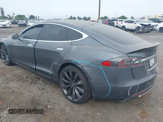 2013 Tesla Model S with VIN 5YJSA1AG5DFP13149, listed as a IAAI auction lot 42116437 with 140,999 mi miles. Bid and sale history available at carsss.com. Image 3.