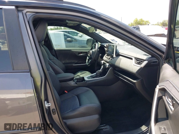 2021 Toyota RAV4 Hybrid XSE with VIN 2T3E6RFV8MW026973, listed as a IAAI auction lot 42052289 with 94,857 mi miles and . Bid and sale history available at DreamBid. Image 5.