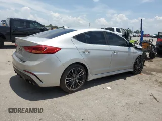 2018 Hyundai Elantra Sport с VIN KMHD04LB8JU556486, выставлен на аукционе Copart как лот 58772815 с пробегом 105 307 миль миль и Списание • Salvage title. История ставок и продаж доступна на DreamBid. Изображение 3.