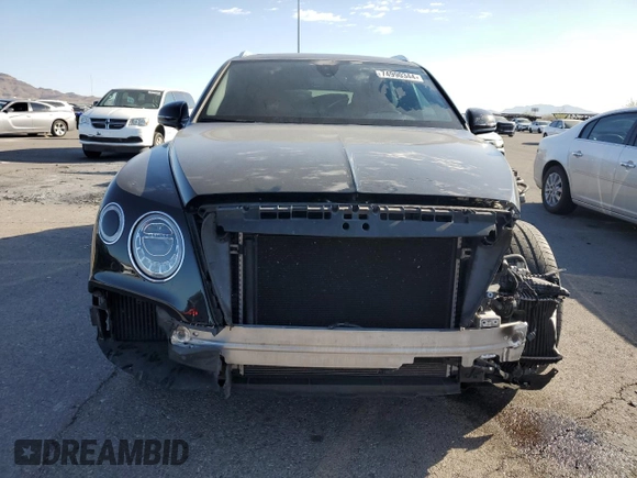 2019 Bentley Bentayga V8 z VIN SJAAM2ZV5KC024154, wystawiony jako Copart lot #74990344 z przebiegiem 41 589 mil mil oraz Szkoda całkowita • Salvage title. Historia ofert i sprzedaży dostępna na DreamBid. Obrazek 5.