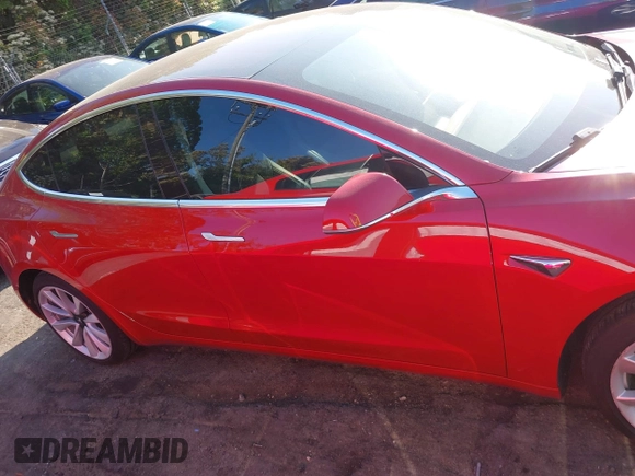 2018 Tesla Model 3 Long Range Battery with VIN 5YJ3E1EA5JF063555, listed as a IAAI auction lot 42028785 with 45,346 mi miles and . Bid and sale history available at DreamBid. Image 13.