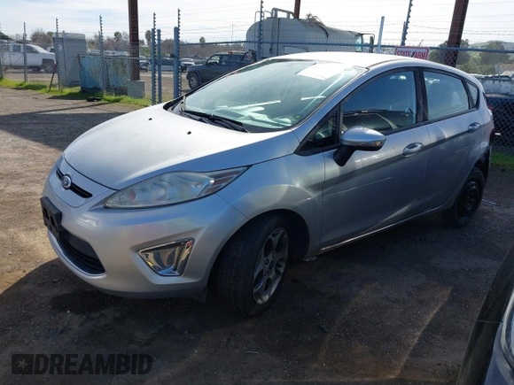 2011 Ford Fiesta SES with VIN 3FADP4FJ1BM149138, listed as a IAAI auction lot 41612288 with 131,798 mi miles. Bid and sale history available at carsss.com. Image 2.