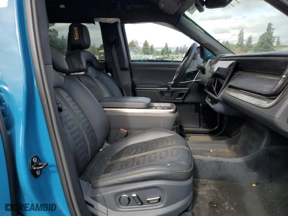 2022 Rivian R1T Launch Edition with VIN 7FCTGAAL0NN001418, listed as a Copart auction lot 75002264 with 28,835 mi miles and Salvage Title. Bid and sale history available at carsss.com. Image 7.