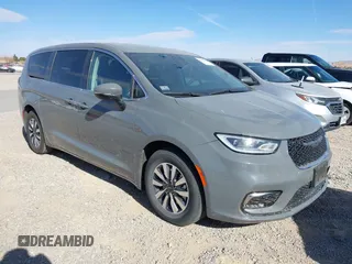 2023 Chrysler Pacifica Hybrid Touring L with VIN 2C4RC1L77PR540913, listed as a IAAI auction lot 41603993 with 27,637 mi miles and . Bid and sale history available at DreamBid. Image 1.