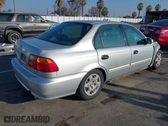 1999 Honda Civic EX with VIN JHMEJ8648XS000823, listed as a IAAI auction lot 41479594 with 299,294 mi miles. Bid and sale history available at carsss.com. Image 4.