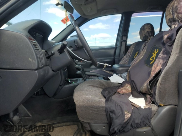 2000 Jeep Grand Cherokee Laredo z VIN 1J4GW48S2YC154627, wystawiony jako Copart lot #54173315 z przebiegiem 251 666 mil mil oraz Szkoda całkowita • Salvage title. Historia ofert i sprzedaży dostępna na DreamBid. Obrazek 7.