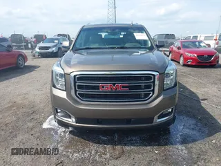 2016 GMC Yukon SLT with VIN 1GKS1BKC9GR328861, listed as a IAAI auction lot 42010839 with 200,711 mi miles. Bid and sale history available at carsss.com. Image 12.