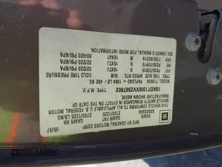 1997 GMC Jimmy SLS with VIN 1GKDT13WXV2567802, listed as a IAAI auction lot 41808103 with 118,001 mi miles. Bid and sale history available at carsss.com. Image 9.