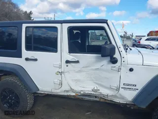 2013 Jeep Wrangler Unlimited Sport with VIN 1C4BJWDG1DL695934, listed as a IAAI auction lot 41691295 with 141,627 mi miles. Bid and sale history available at carsss.com. Image 13.