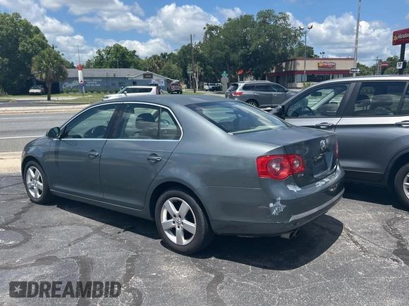 2006 Volkswagen Jetta z VIN 3VWRG81K46M724245, wystawiony jako Copart lot #57293785 z przebiegiem 212 639 mil mil oraz Czysty tytuł • Clean title. Historia ofert i sprzedaży dostępna na DreamBid. Obrazek 3.
