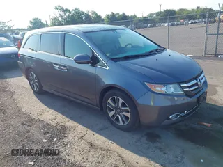 2014 Honda Odyssey Touring with VIN 5FNRL5H91EB073806, listed as a IAAI auction lot 42585467 with 77,890 mi miles and . Bid and sale history available at DreamBid. Image 1.