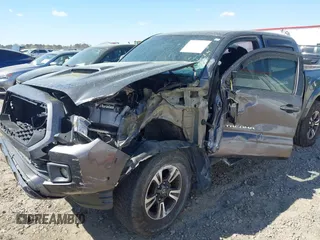 2017 Toyota Tacoma SR5 with VIN 5TFAZ5CN7HX033594, listed as a IAAI auction lot 41881117 with 86,676 mi miles and . Bid and sale history available at DreamBid. Image 6.