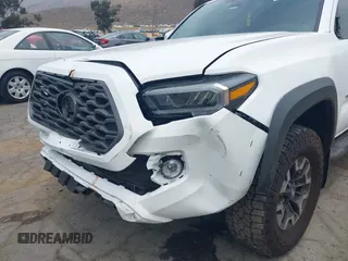 2023 Toyota Tacoma SR with VIN 3TMCZ5AN1PM556299, listed as a IAAI auction lot 42344160 with 42,338 mi miles and . Bid and sale history available at DreamBid. Image 6.