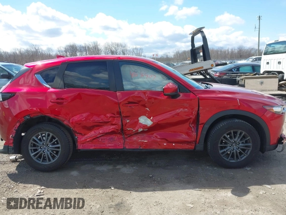 2021 Mazda CX-5 Touring z VIN JM3KFBCM1M0401717, wystawiony jako IAAI lot #42036407 z przebiegiem 35 587 mil mil oraz . Historia ofert i sprzedaży dostępna na DreamBid. Obrazek 13.