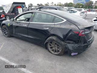 2019 Tesla Model 3 Mid Range with VIN 5YJ3E1EA2KF362048, listed as a IAAI auction lot 40141734 with 70,321 mi miles and . Bid and sale history available at carsss.com. Image 13.