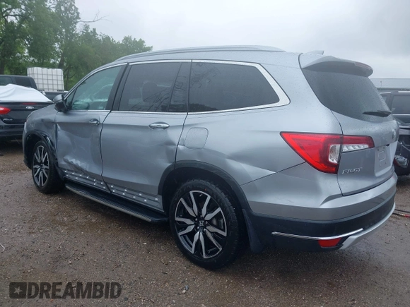 2019 Honda Pilot Touring 8-Passenger with VIN 5FNYF6H98KB097105, listed as a IAAI auction lot 42353009 with 133,212 mi miles and . Bid and sale history available at DreamBid. Image 6.